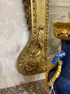 Lot 239 - A George II carved giltwood pier mirror