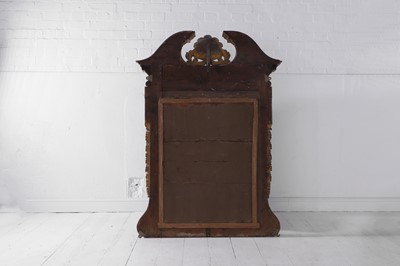 Lot 239 - A George II carved giltwood pier mirror