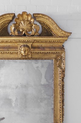 Lot 239 - A George II carved giltwood pier mirror