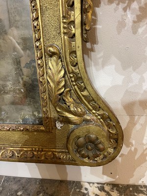 Lot 239 - A George II carved giltwood pier mirror