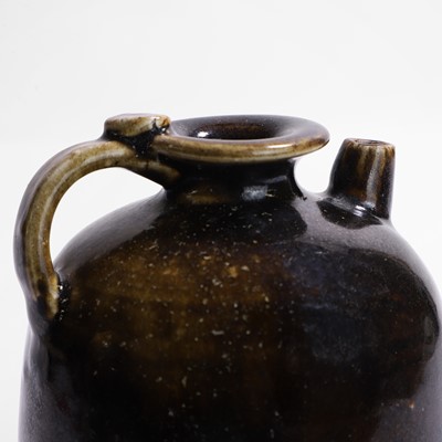 Lot 7 - A Chinese black-glazed ewer