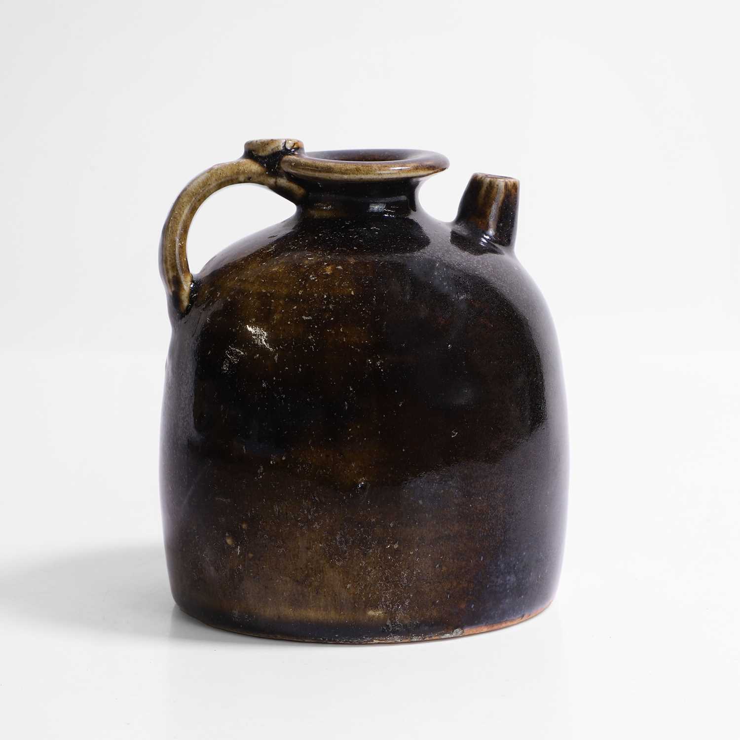 Lot 7 - A Chinese black-glazed ewer