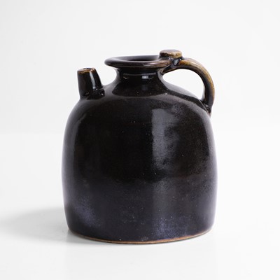 Lot 7 - A Chinese black-glazed ewer
