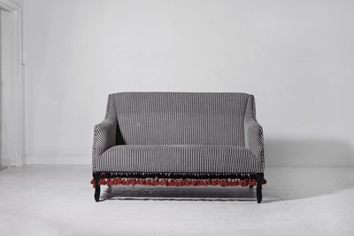 Lot 88 - A small upholstered sofa by OKA