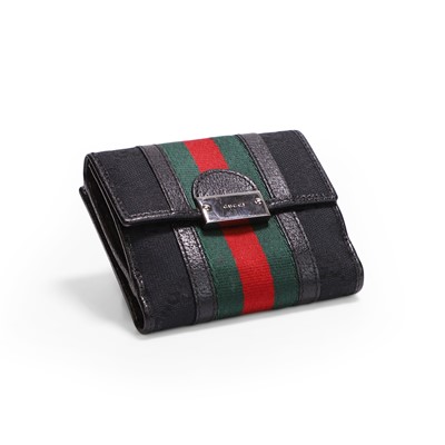 Lot 1437 - A Gucci black monogram canvas wallet