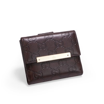 Lot 1439 - A Gucci brown leather monogram leather purse