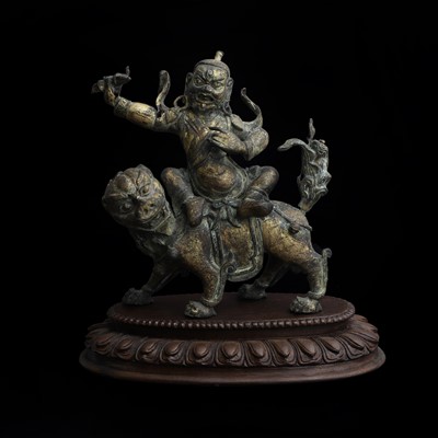 Lot 122 - A Tibetan parcel-gilt bronze figure of a deity