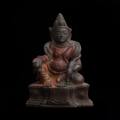 Lot 267 - A Tibetan painted bronze figure of Kubera