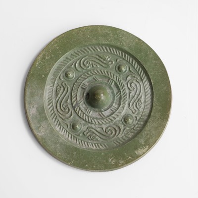 Lot 136 - A Chinese bronze mirror