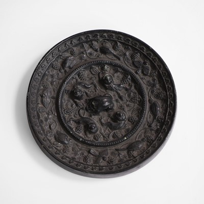 Lot 138 - A Chinese bronze mirror