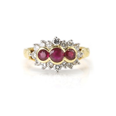 Lot 123 - An 18ct gold ruby and diamond cluster ring