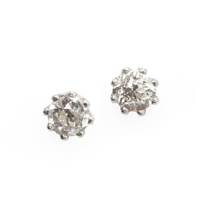 Lot 1041 - A pair of white gold diamond stud earrings
