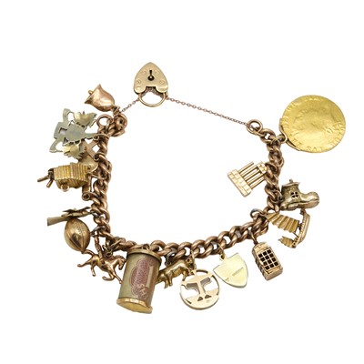 Lot 1260 - A 9ct gold charm bracelet with gold coin