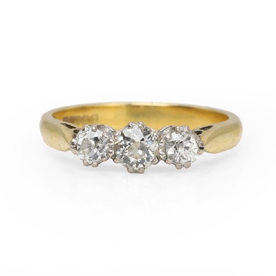 Lot 1065 - An 18ct gold diamond three stone ring