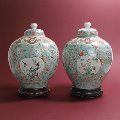 Lot 88 - A pair of Chinese famille verte jars and covers