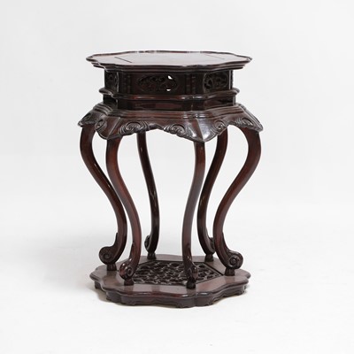 Lot 98 - A Chinese carved hardwood stand