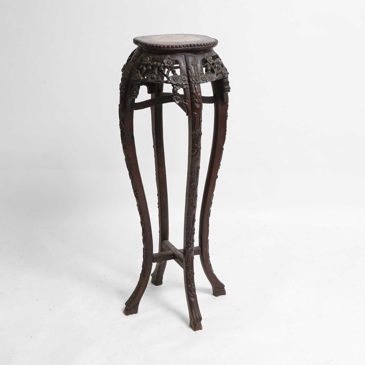 Lot 508 - A Chinese carved hardwood jardinière stand