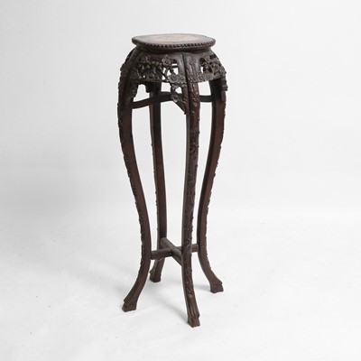 Lot 100 - A Chinese carved hardwood jardinière stand