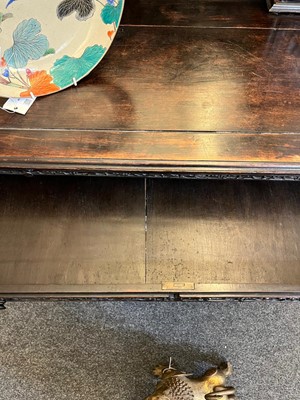 Lot 152 - A Chinese carved hardwood kneehole desk