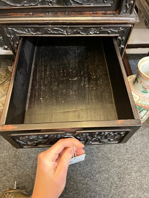 Lot 152 - A Chinese carved hardwood kneehole desk