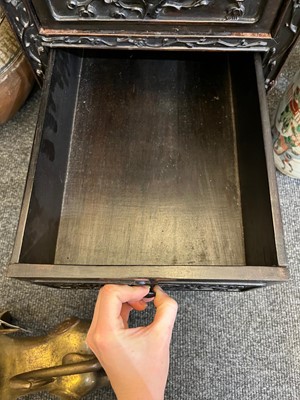 Lot 152 - A Chinese carved hardwood kneehole desk