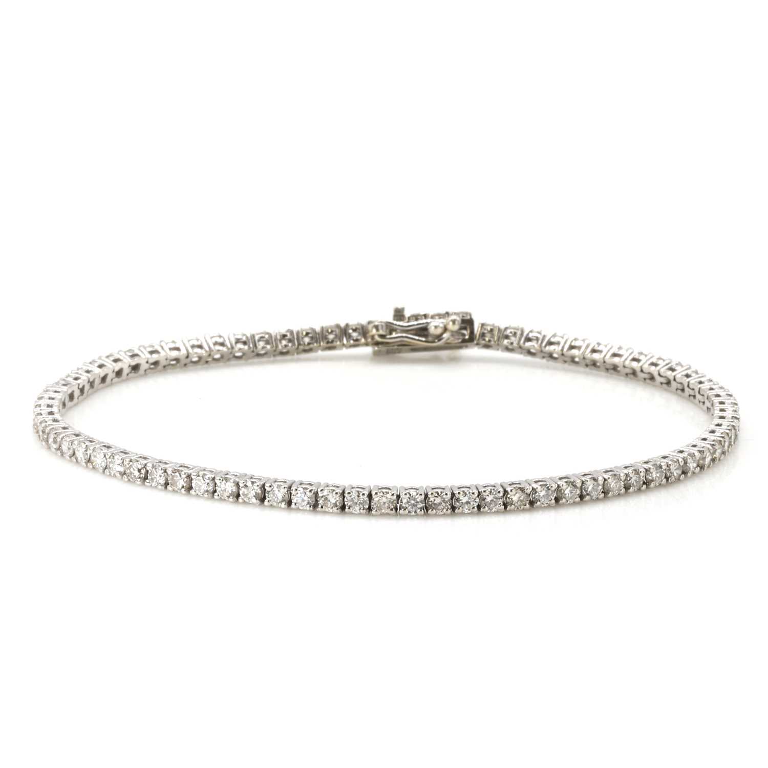 Lot 75 - A white gold diamond line bracelet
