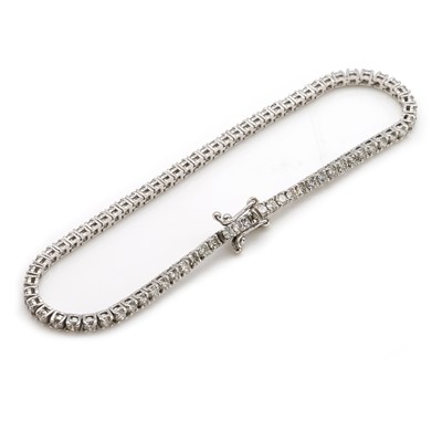 Lot 75 - A white gold diamond line bracelet
