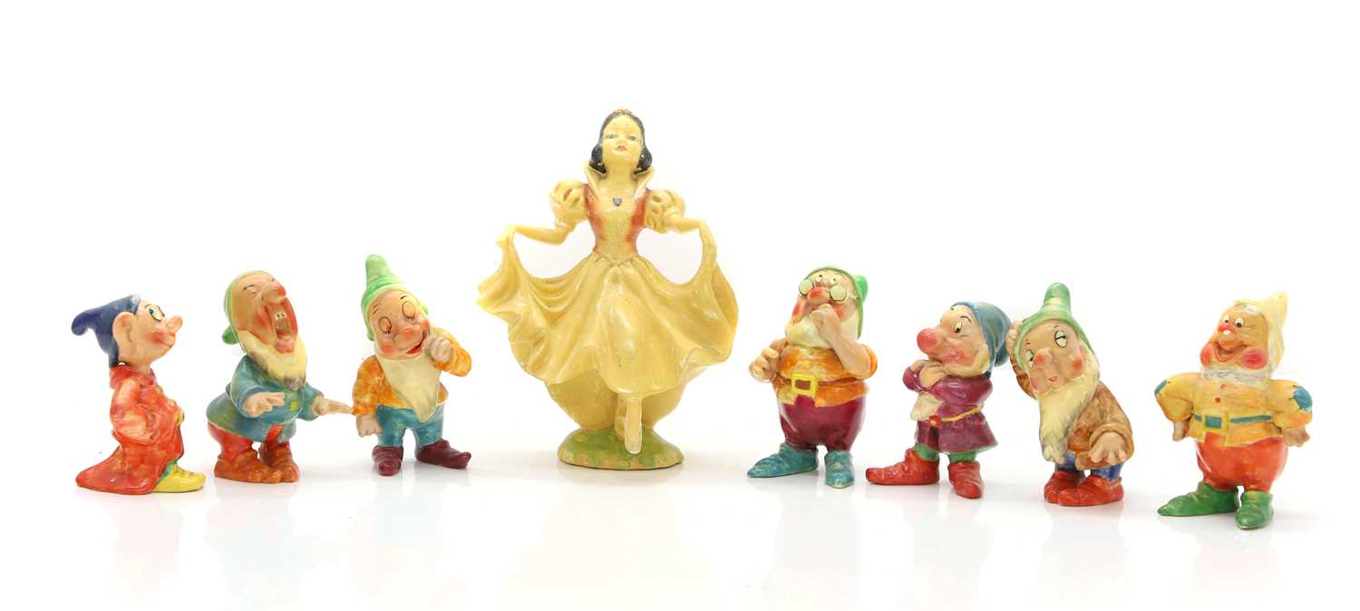Lot 111 - A set of Wade Heath Snow White and the Seven Dwarves figures