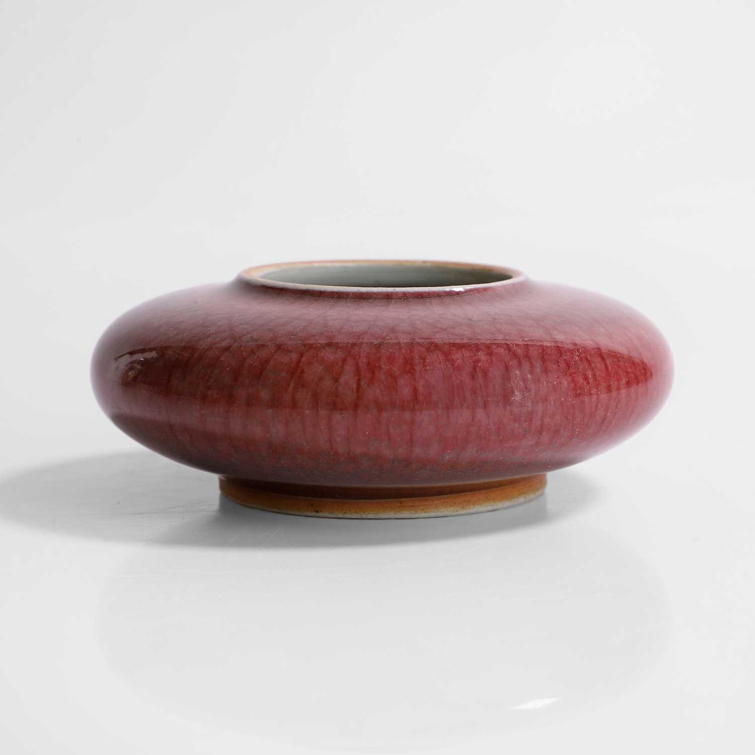 Lot 65 - A Chinese red-glazed brush washer