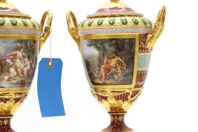 Lot 110 - A large pair of Vienna porcelain urns and covers