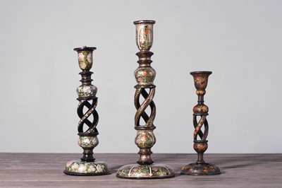 Lot 450 - Three papier mâché candlesticks
