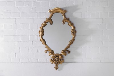 Lot 74 - A carved giltwood mirror in the George III taste