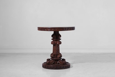 Lot 208 - A carved hardwood and brass centre table