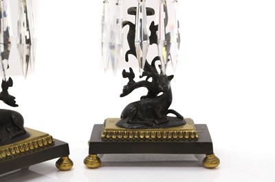 Lot 301 - A pair of Regency style brass and patinated bronze table lustres