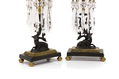 Lot 301 - A pair of Regency style brass and patinated bronze table lustres