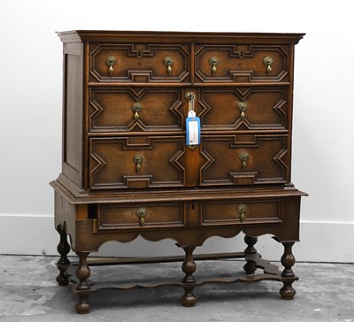 Lot 503 - An oak chest on stand