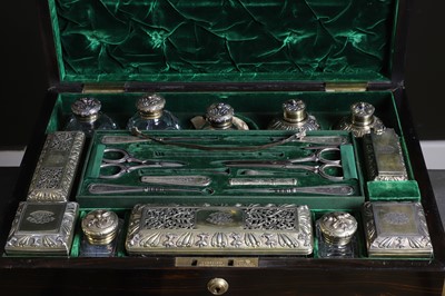 Lot 447 - A George IV rosewood and silver-gilt cased dressing table set