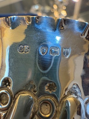 Lot 2 - A set of four silver bottle coasters or holders