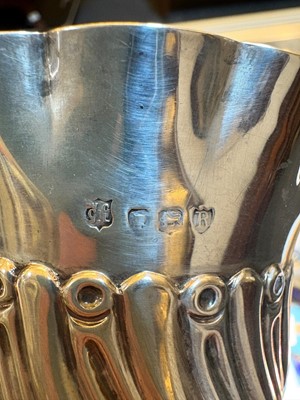 Lot 2 - A set of four silver bottle coasters or holders