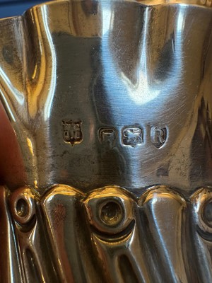 Lot 2 - A set of four silver bottle coasters or holders