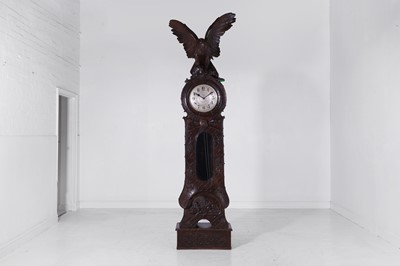 Lot 236 - A Black Forest carved wooden longcase clock