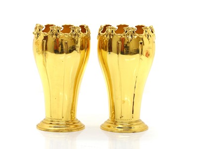 Lot 9 - A pair of silver gilt vases
