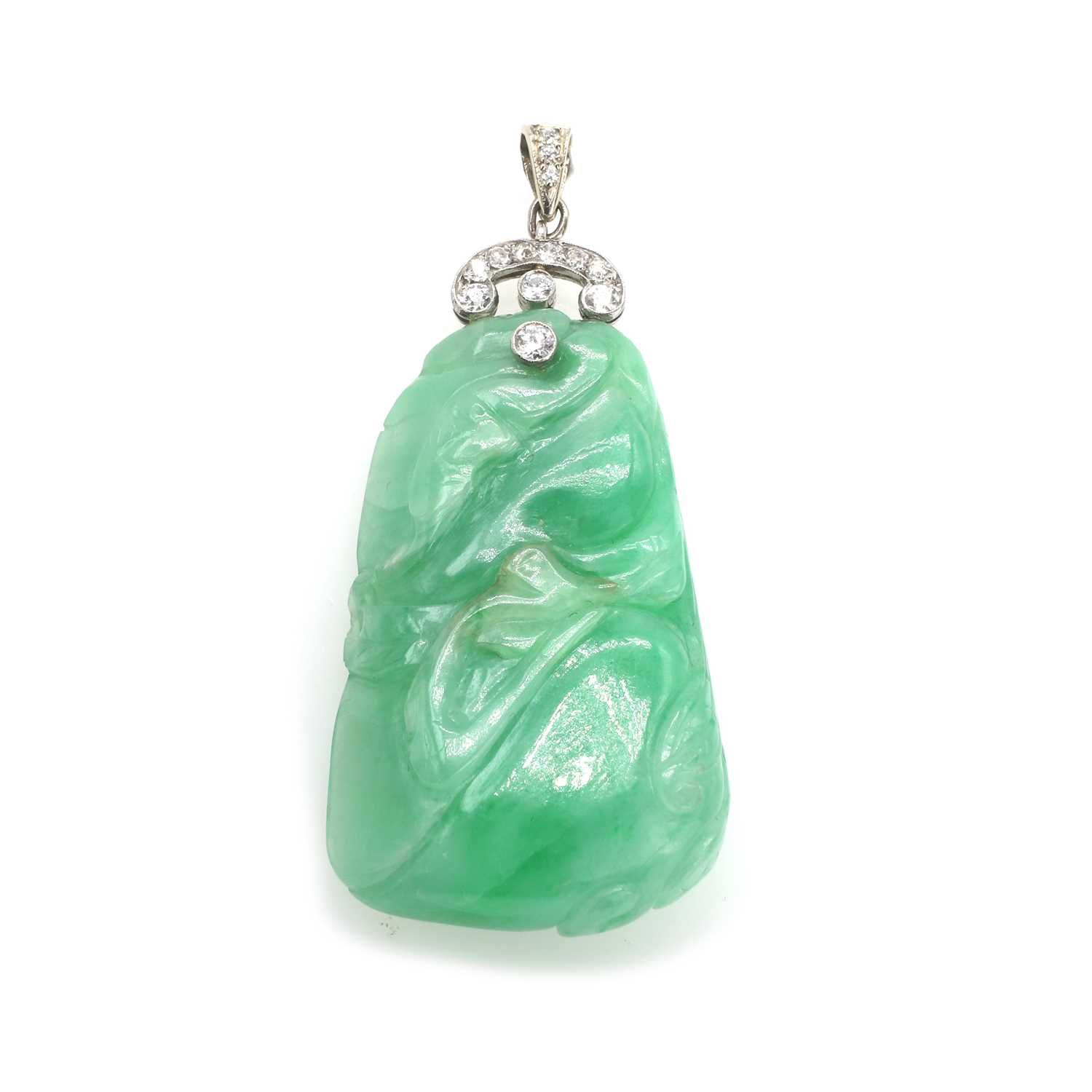 Lot 51 - A carved jade and diamond pendant