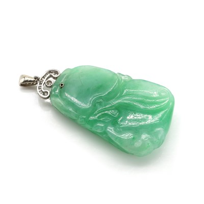 Lot 51 - A carved jade and diamond pendant