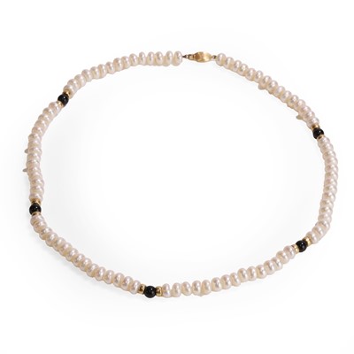 Lot 1138 - A uniform single row freshwater cultured pearl necklace