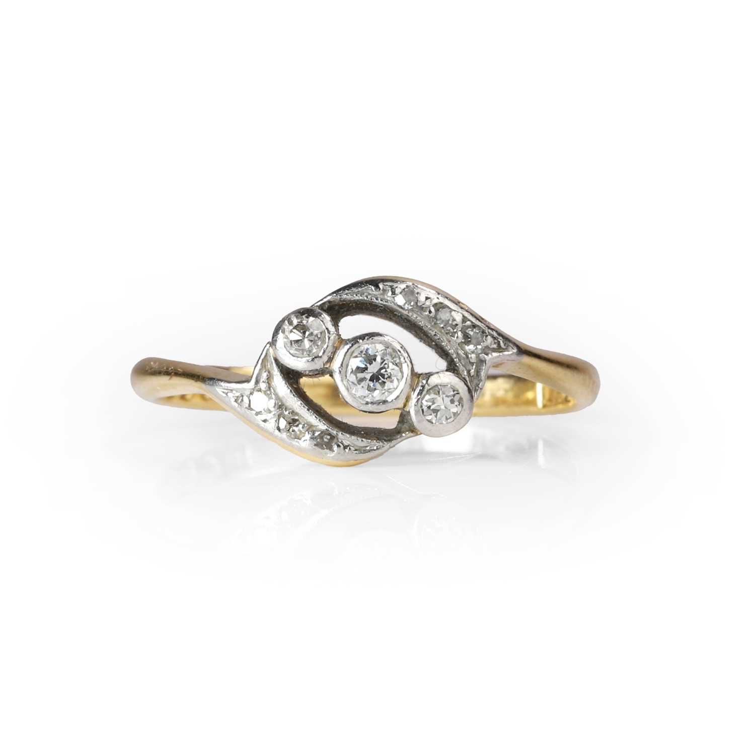 Lot 1035 - A diamond crossover ring