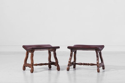 Lot 474 - A matched pair of walnut and leather stools