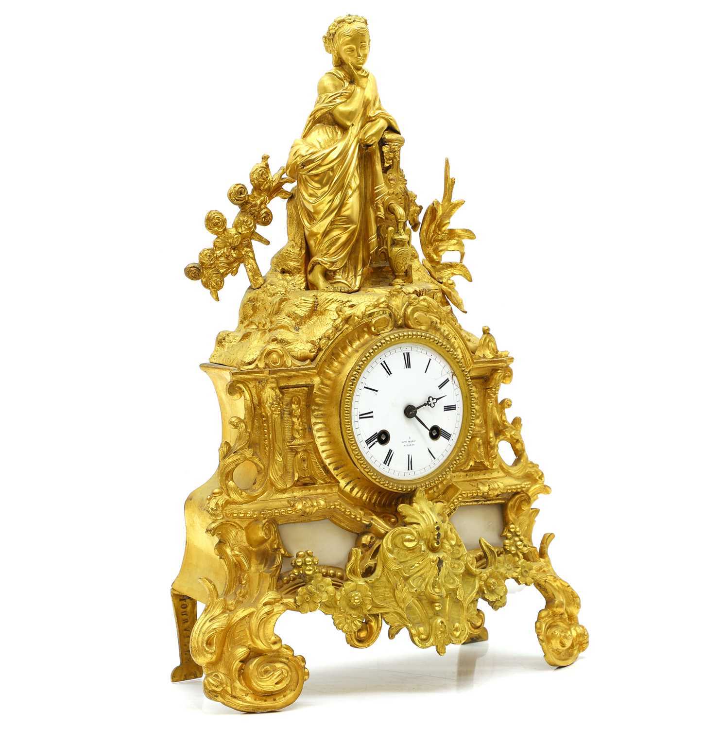 Lot 207 - A gilt metal and marble mantel clock