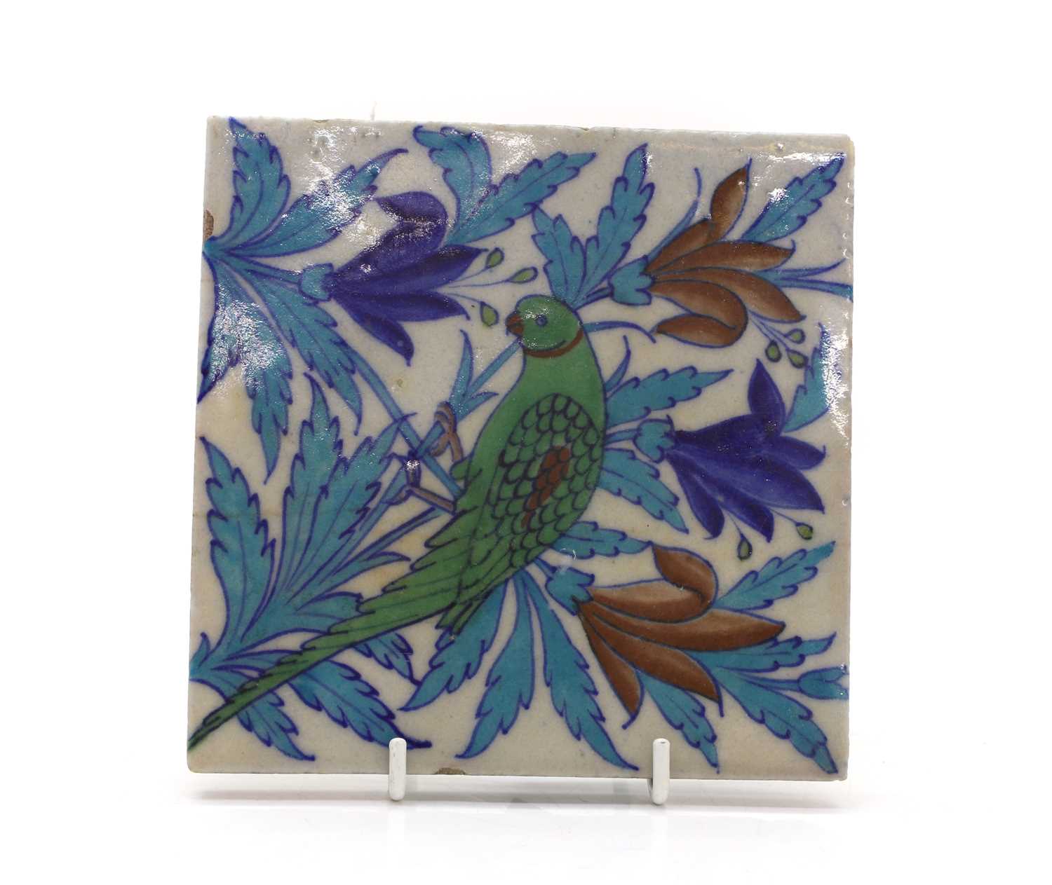 Lot 102 - An Iznik-style glazed stoneware tile