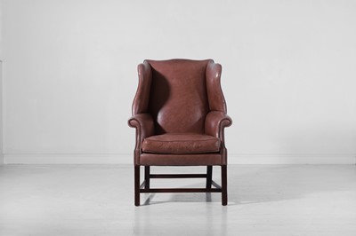 Lot 67 - A George III mahogany and leather wing armchair